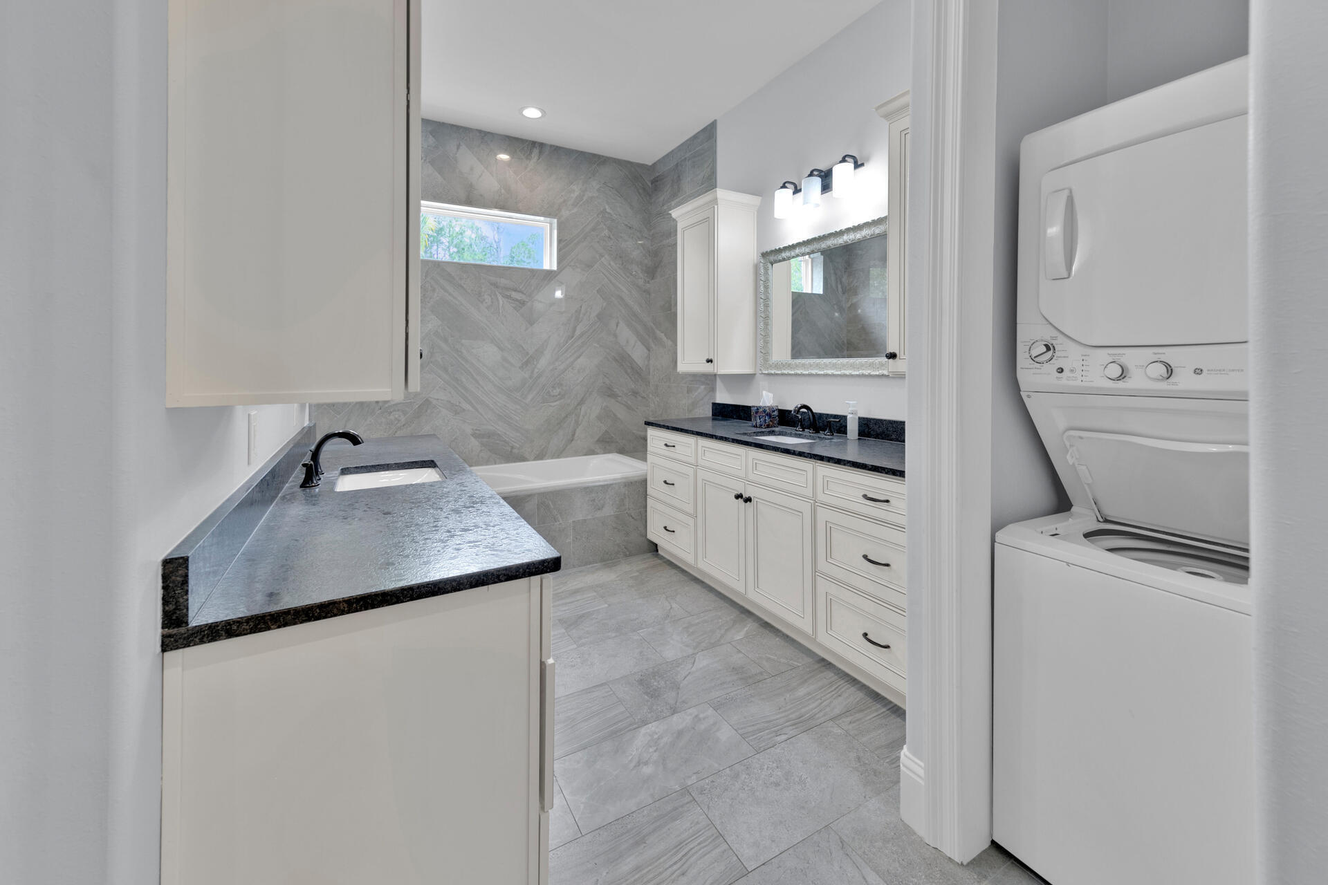 617 Churchill Bayou Road Santa Rosa Beach, FL 32459 - Photo 33 of 67 a bathroom with a granite countertop double vanity sink a mirror and a