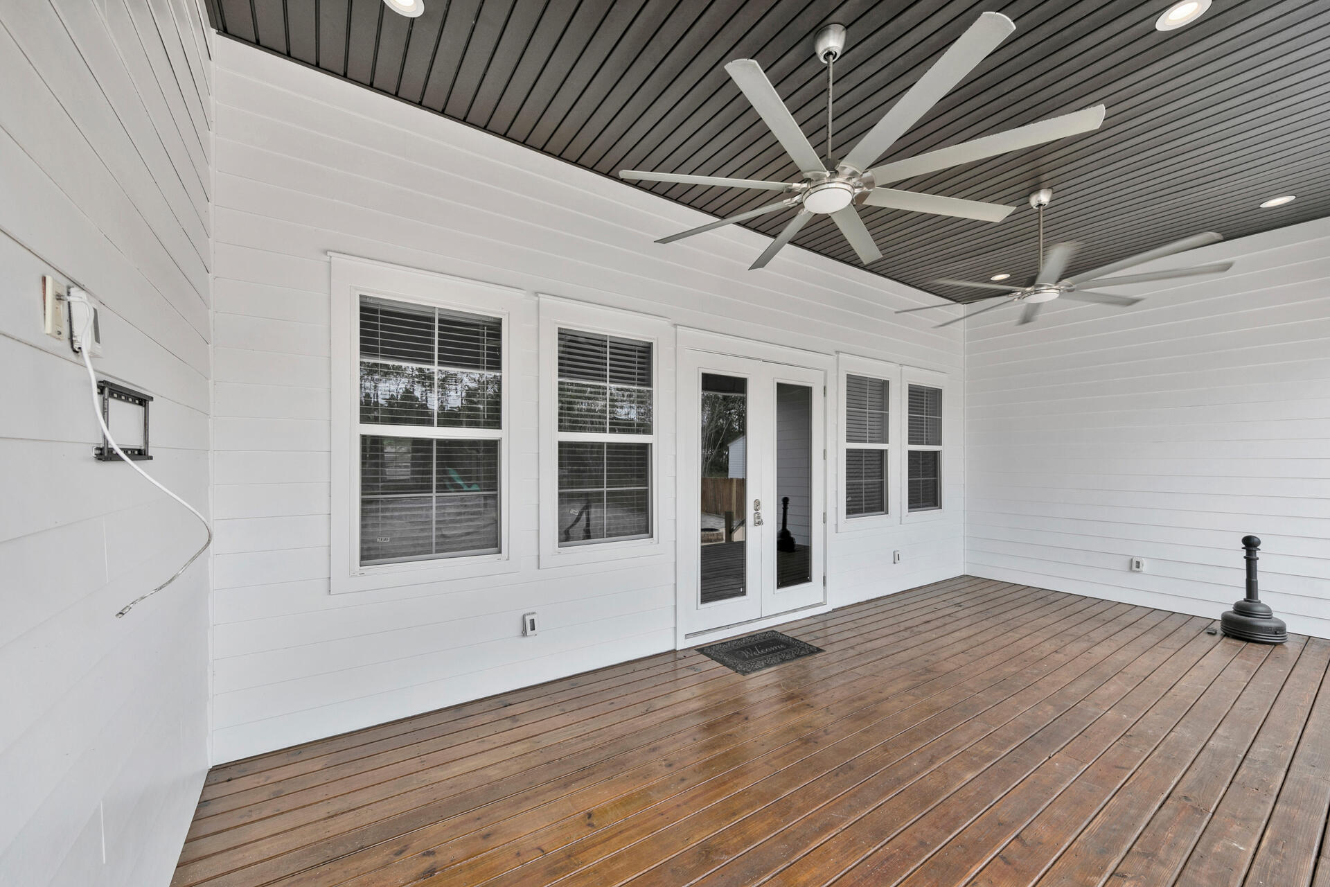 617 Churchill Bayou Road Santa Rosa Beach, FL 32459 - Photo 42 of 67 a view of an empty room with a window and wooden floor