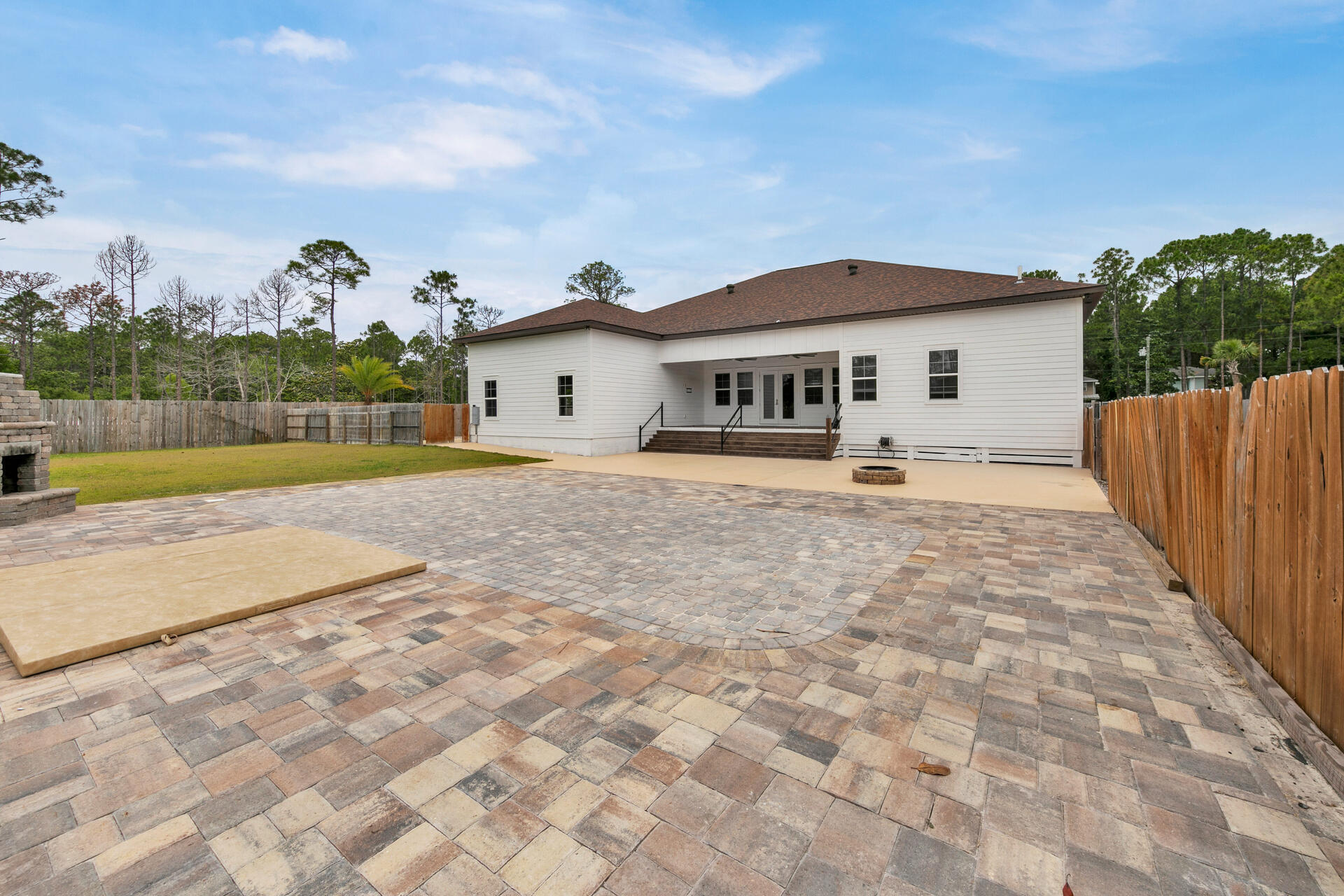 617 Churchill Bayou Road Santa Rosa Beach, FL 32459 - Photo 45 of 67 a view of house with outdoor space and trees in the background