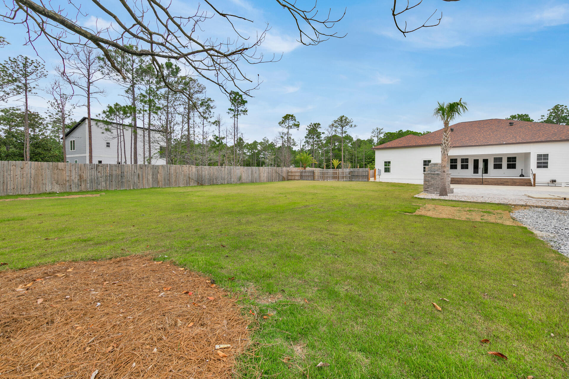 617 Churchill Bayou Road Santa Rosa Beach, FL 32459 - Photo 50 of 67 a view of big yard with a house in the background