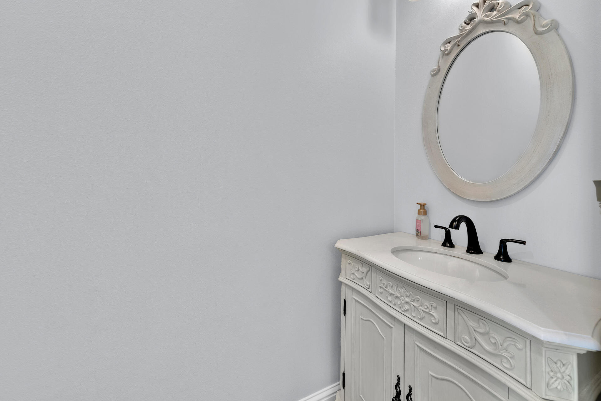 617 Churchill Bayou Road Santa Rosa Beach, FL 32459 - Photo 5 of 67 a bathroom with a sink and a mirror