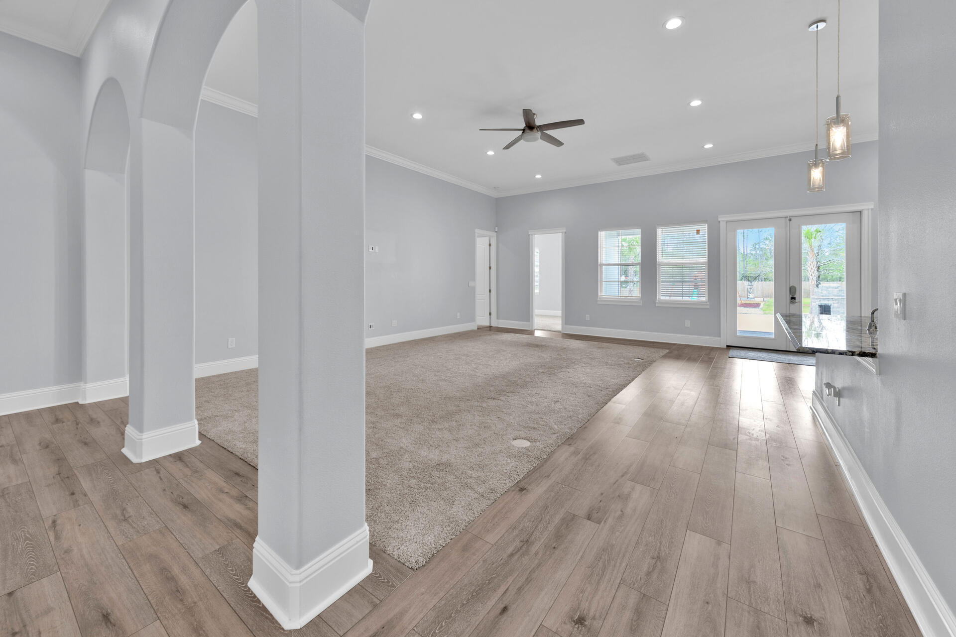 617 Churchill Bayou Road Santa Rosa Beach, FL 32459 - Photo 6 of 67 a view of an empty room with wooden floor and a window