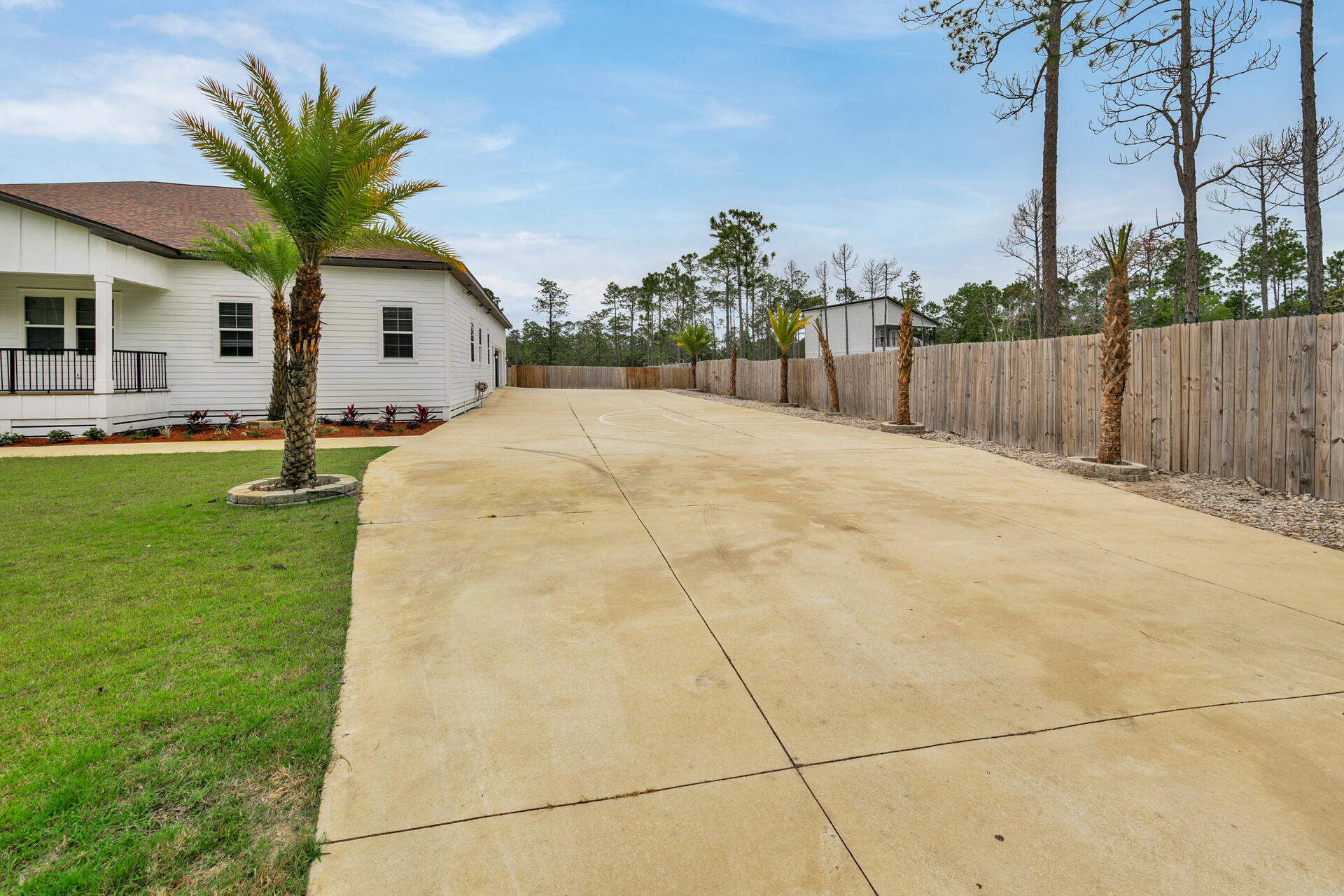 617 Churchill Bayou Road Santa Rosa Beach, FL 32459 - Photo 62 of 67 a front view of a house with a yard and garage