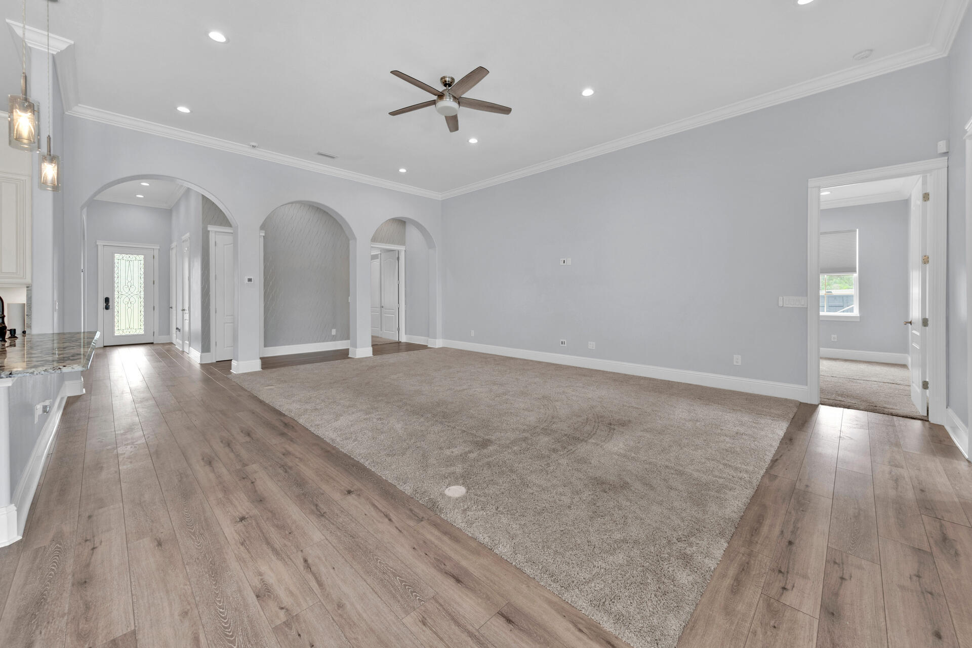 617 Churchill Bayou Road Santa Rosa Beach, FL 32459 - Photo 9 of 67 wooden floor in an empty room with a window