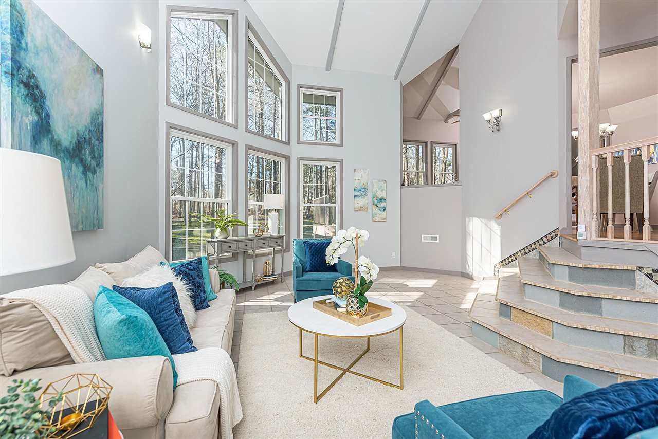Large windows overlooking Living Room give you that truly Cabin in the Woods feel to your home with privacy from surrounding trees. Living Room