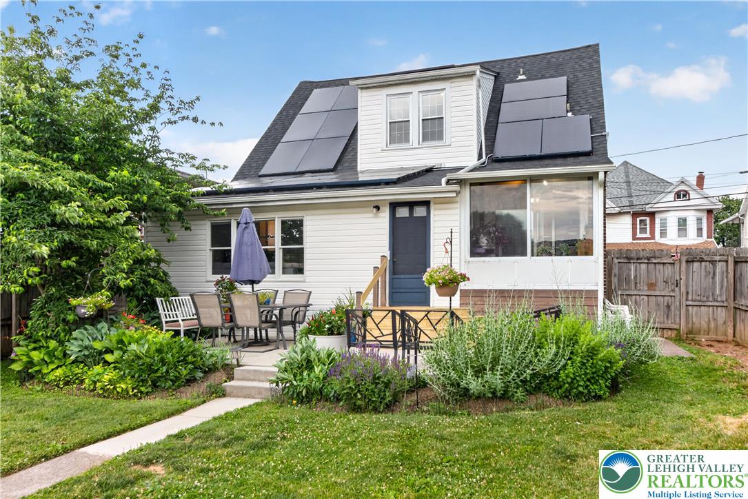 534 Ridge Street Emmaus, PA 18049 - Photo 35 of 40 a front view of a house with a yard and potted plants