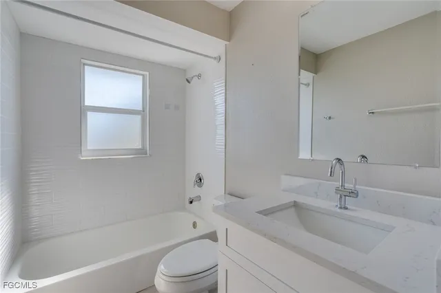 a bathroom with a sink toilet and bathtub