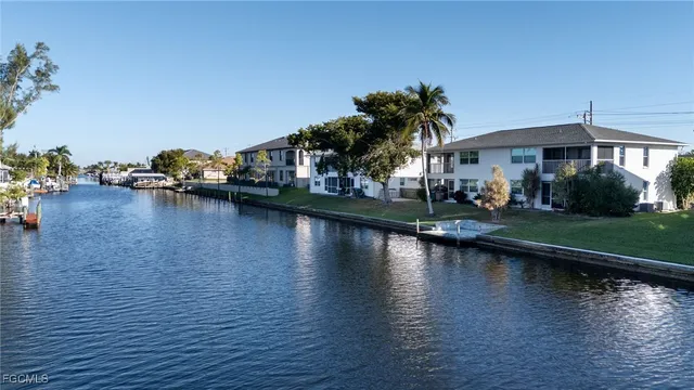 a view of a lake with a house in the background