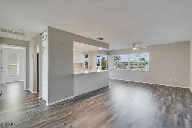 a view of kitchen and wooden floor