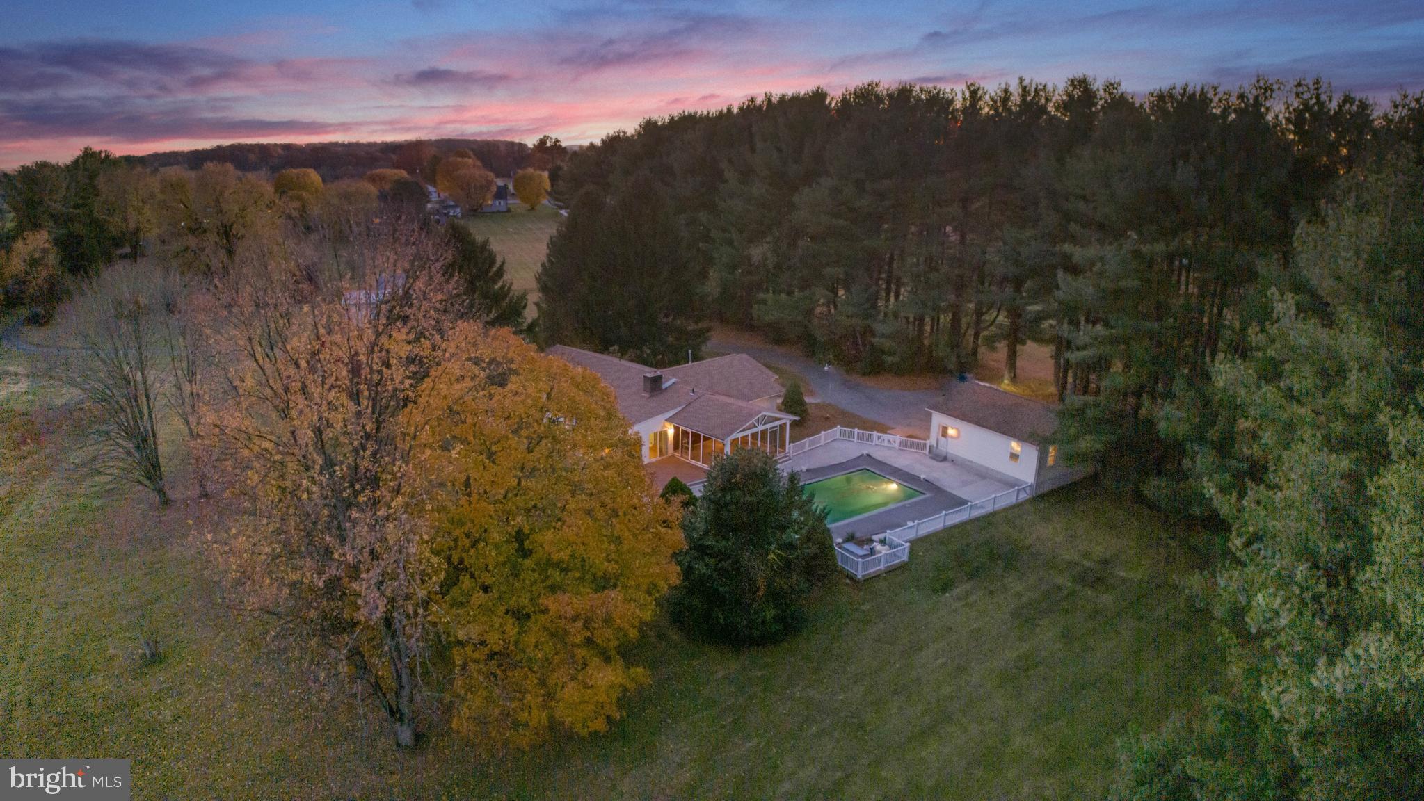 3116 Mt Carmel Road Upperco, MD 21155 - Photo 21 of 28 a view of a city with lush green forest