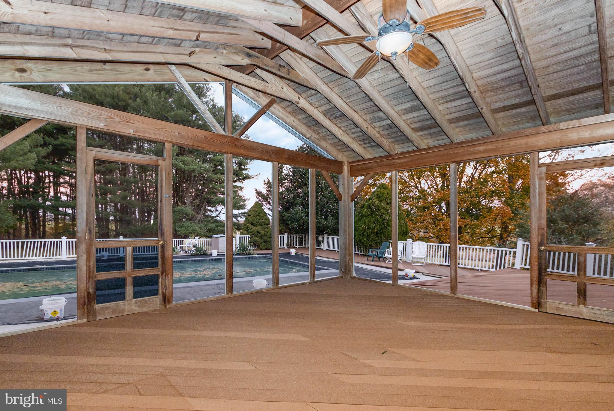 3116 Mt Carmel Road Upperco, MD 21155 - Photo 10 of 28 a view of a swimming pool with a porch