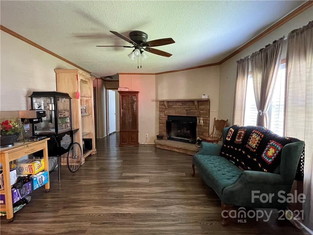 158 Doster Road Lancaster, SC 29720 - Photo 8 of 18 a living room with furniture fireplace and flat screen tv