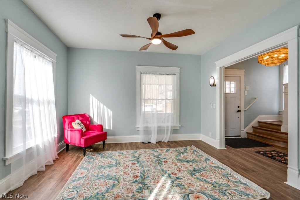 12 South 4th Street Rittman, OH 44270 - Photo 11 of 48 Living area featuring ceiling fan, wood finished floors, and healthy amount of natural light