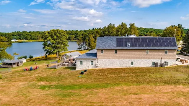a view of a swimming pool with an outdoor seating and a garden