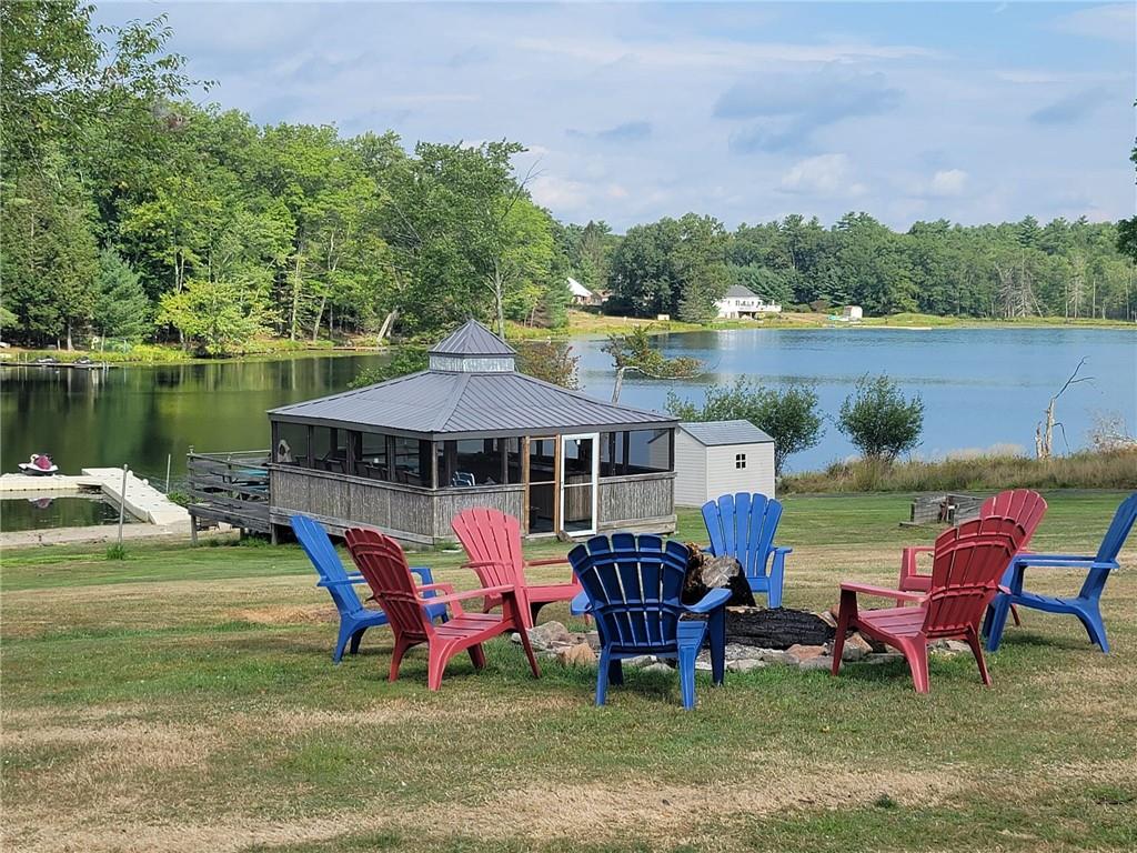 35 Washington Lake Road Eldred, NY 12732 - Photo 16 of 35 a view of a lake with chairs and table under an umbrella