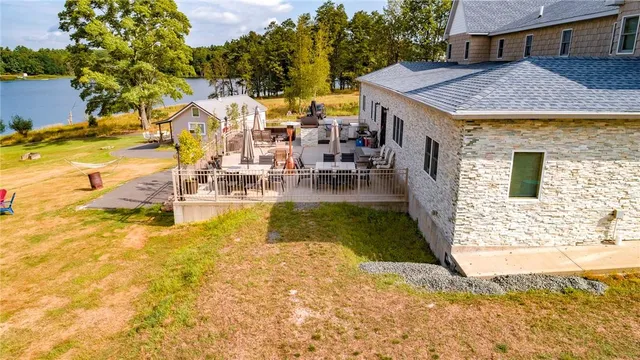 a view of a patio with dining table and chairs with a patio