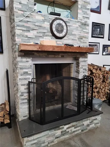 a living room with lots of furniture and a book shelf