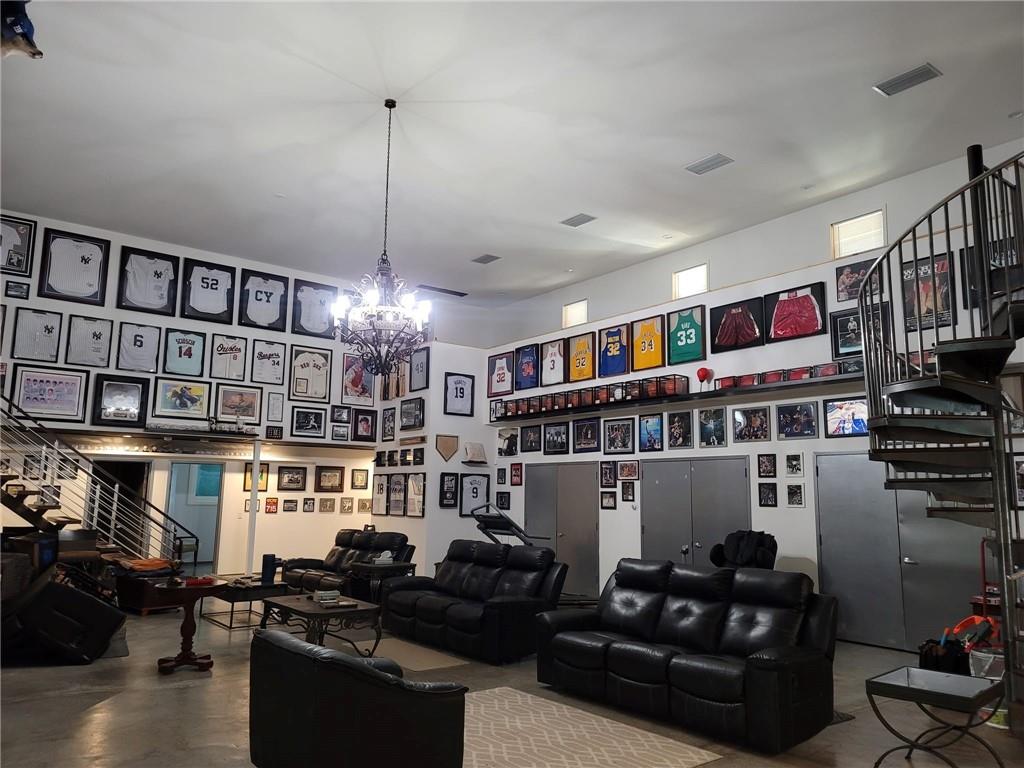 35 Washington Lake Road Eldred, NY 12732 - Photo 23 of 35 a living room with lots of furniture and a book shelf