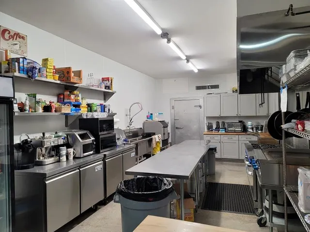 a kitchen with appliances cabinets and a sink