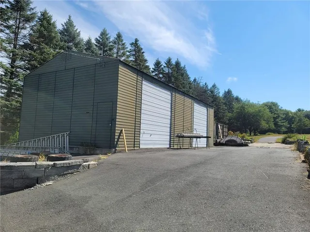 a view of a road with a cars park