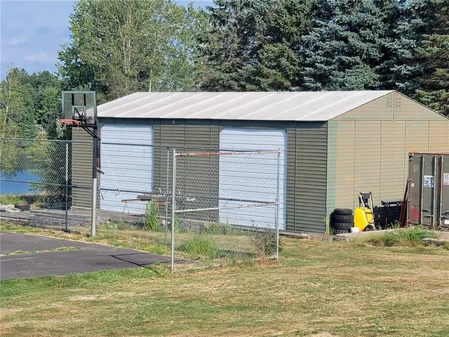 a view of a yard with a tree