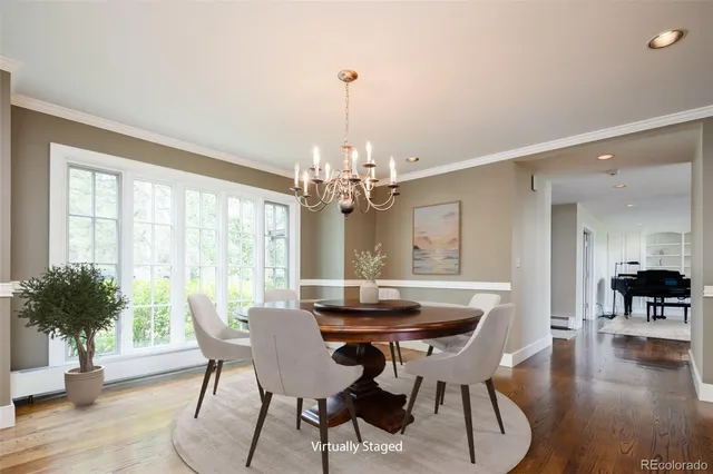 a living room with furniture and large windows