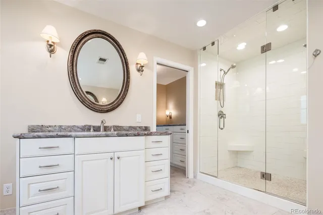 a view of a hallway with wooden floor and furniture