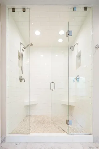 a bathroom with a granite countertop sink mirror and toilet