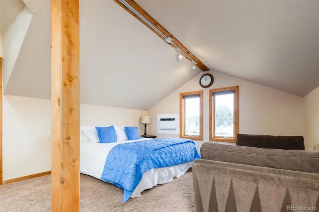 an aerial view of residential houses with outdoor space and swimming pool