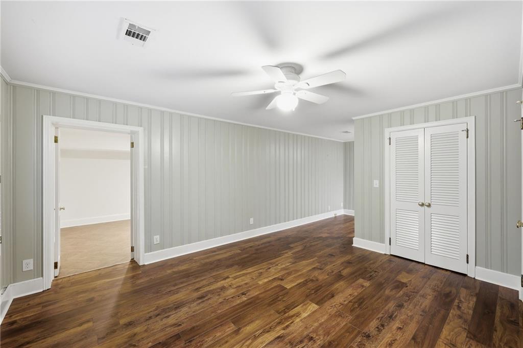 1281 Springdale Road Gainesville, GA 30501 - Photo 68 of 91 a view of an empty room with wooden floor