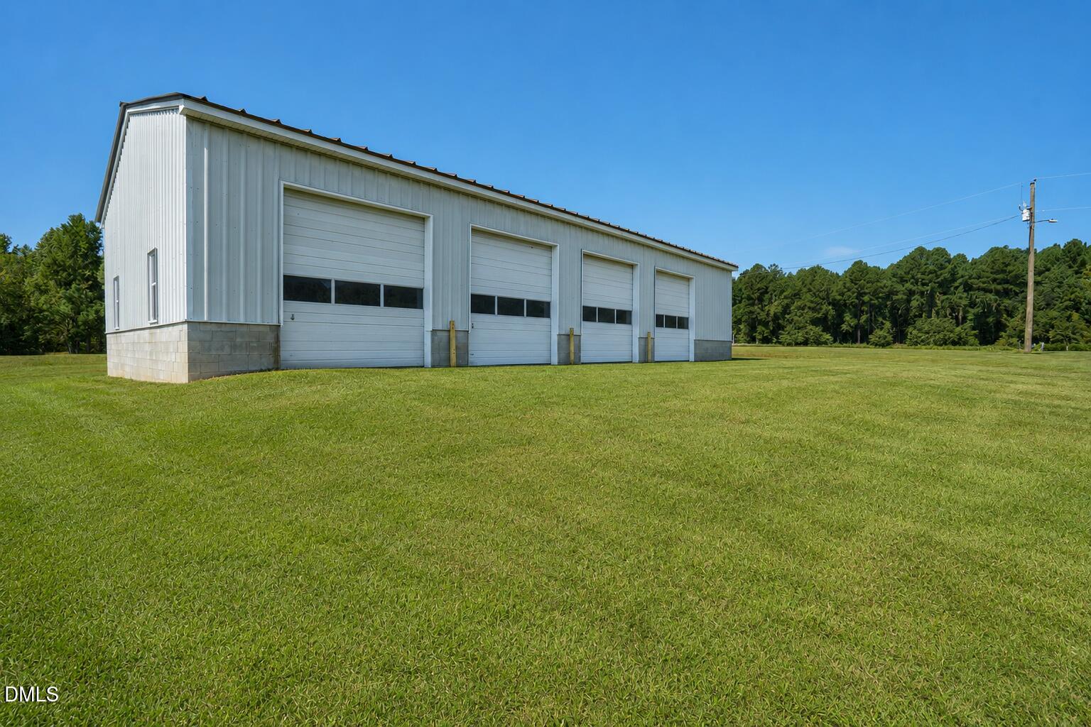 6515 Tonya Road Elm City, NC 27822 - Photo 30 of 52 a view of a house with a yard