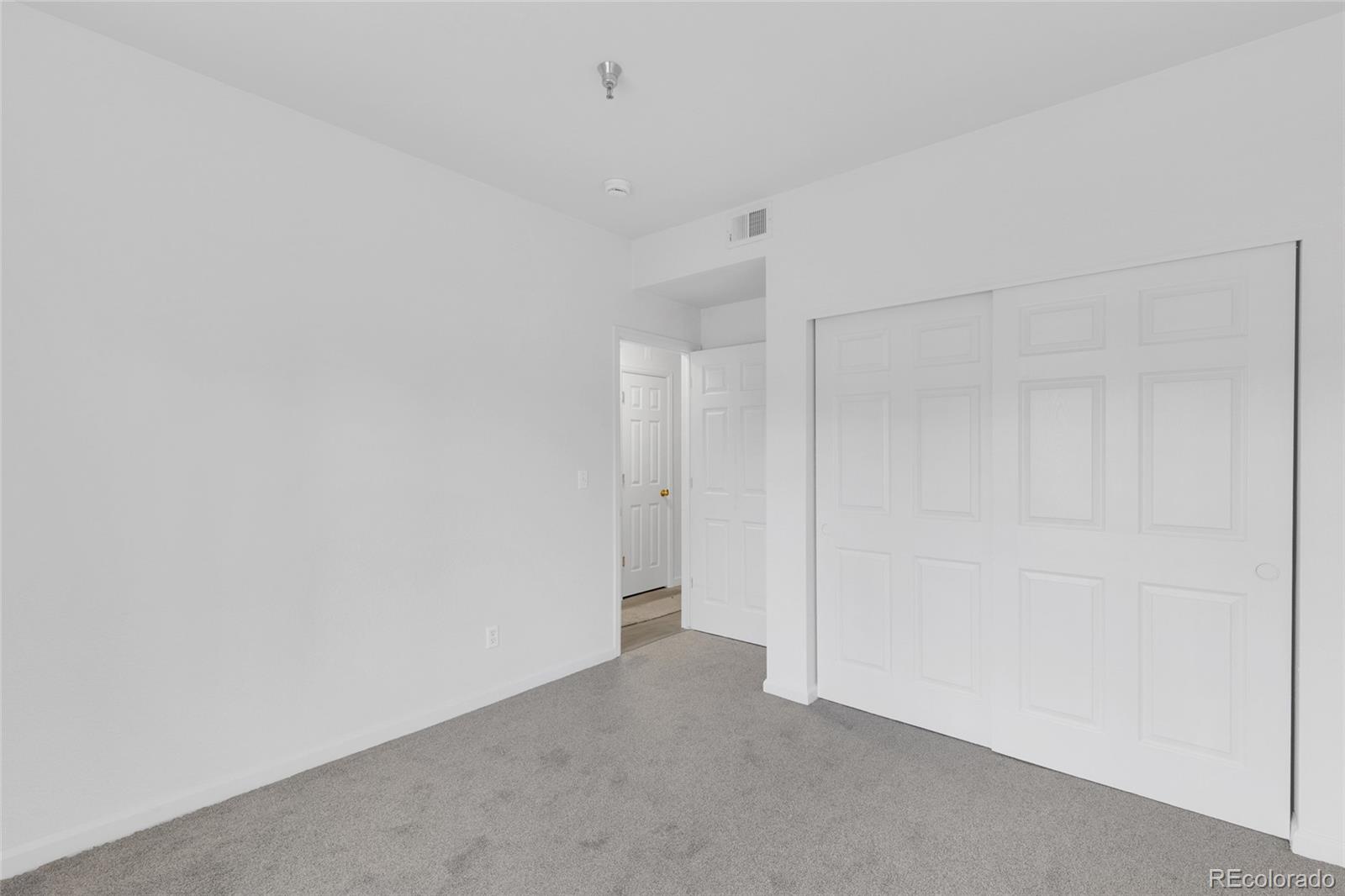 2575 South Syracuse Way, Unit G104 Denver, CO 80231 - Photo 11 of 20 a view of an empty room