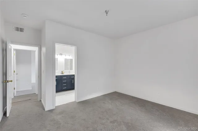 a view of an empty room and fire place