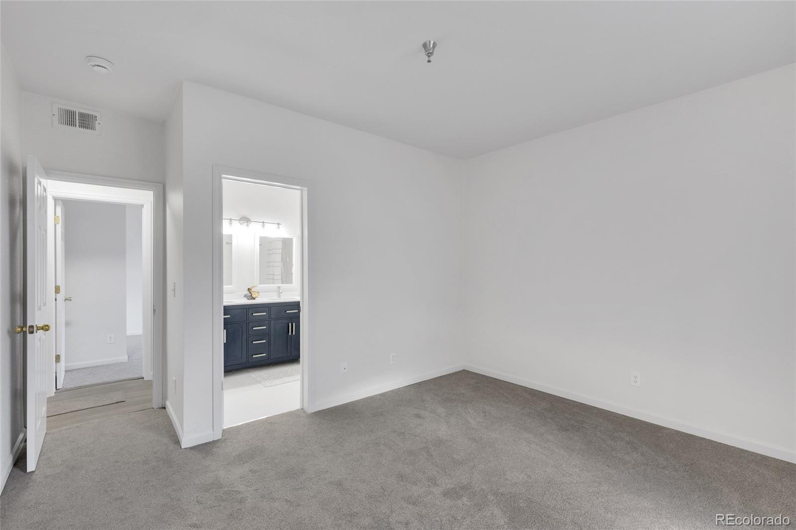 2575 South Syracuse Way, Unit G104 Denver, CO 80231 - Photo 13 of 20 a view of an empty room and fire place