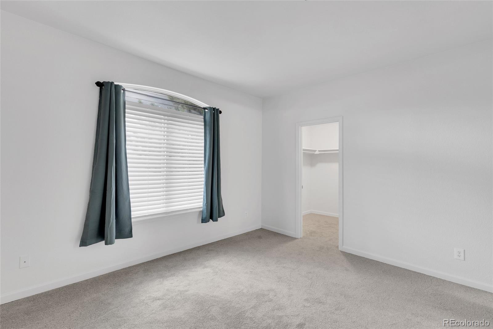 2575 South Syracuse Way, Unit G104 Denver, CO 80231 - Photo 15 of 20 an empty room with a window