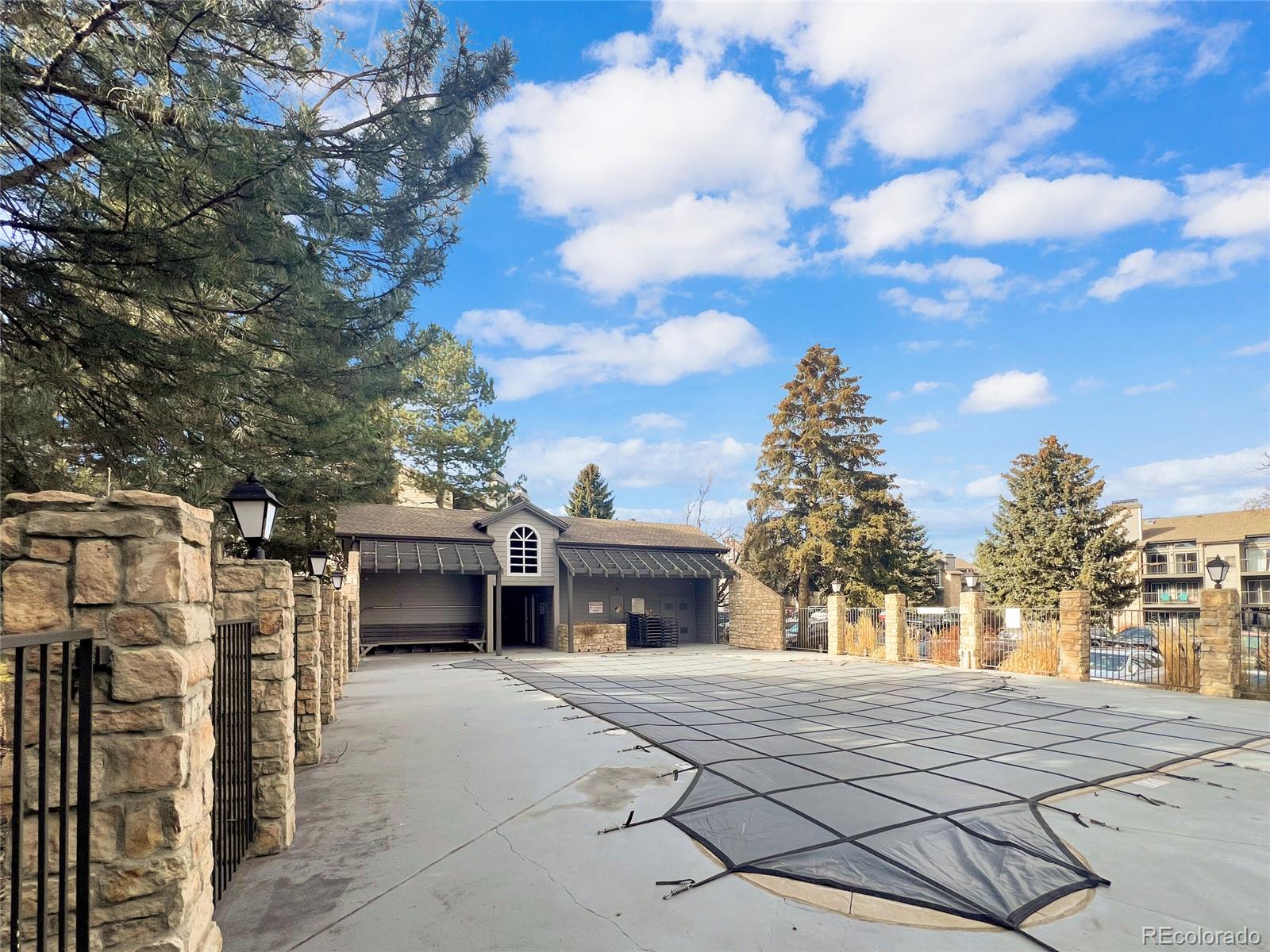 2575 South Syracuse Way, Unit G104 Denver, CO 80231 - Photo 20 of 20 a front view of a house with a yard