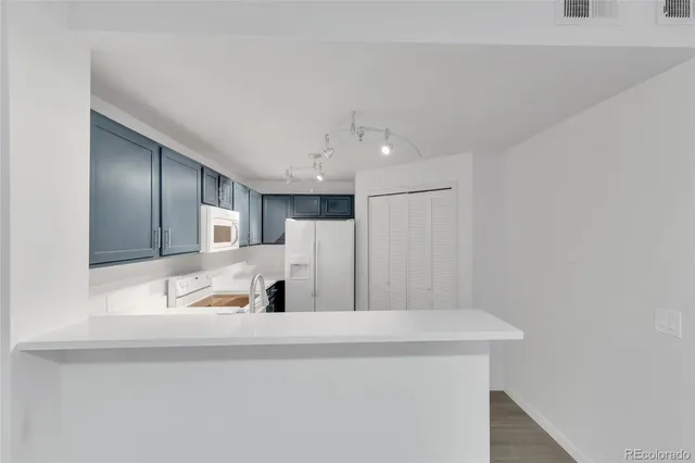a view of a kitchen with a sink