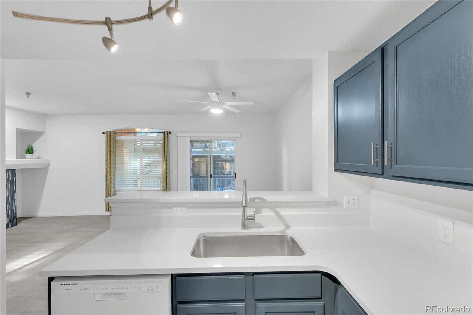 2575 South Syracuse Way, Unit G104 Denver, CO 80231 - Photo 5 of 20 a bathroom with a sink and a mirror