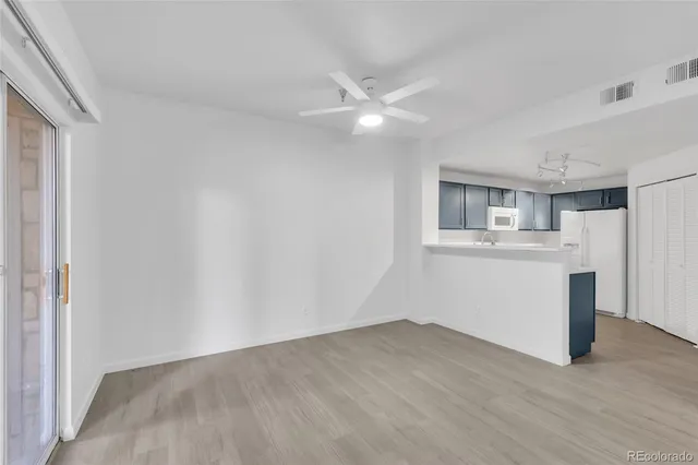 a view of a kitchen with a sink and a window