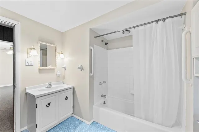 a white toilet sitting next to a bathroom sink