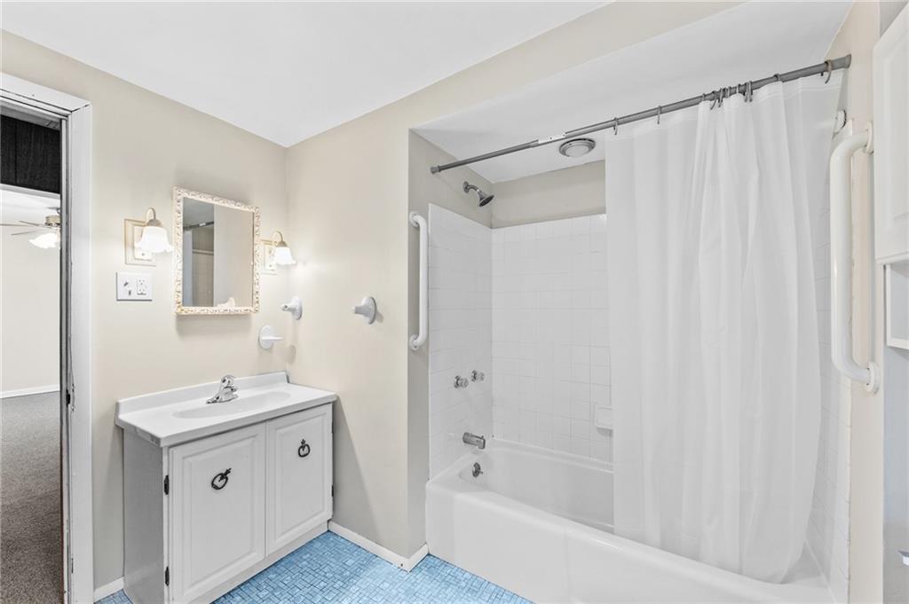 807 Oak Street Monessen, PA 15062 - Photo 12 of 28 a bathroom with a double vanity sink a shower and a mirror