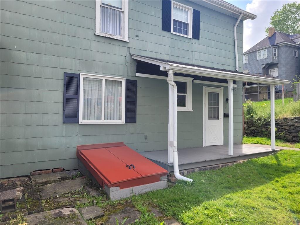 807 Oak Street Monessen, PA 15062 - Photo 25 of 28 a backyard of a house with seating space