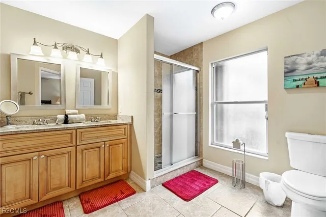 a spacious bathroom with a bath tub and a sink