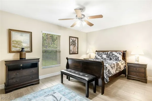 a bedroom with a bed and a dresser in it