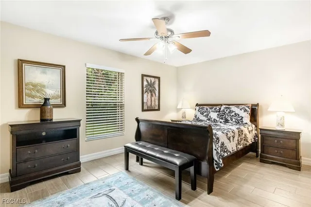 a bedroom with a bed and a dresser in it