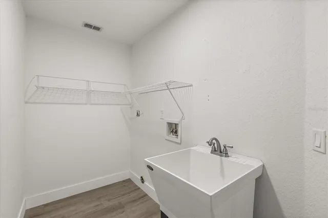 a bathroom with a sink and vanity