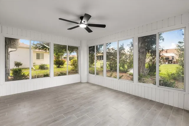 a view of room with window and wooden floor