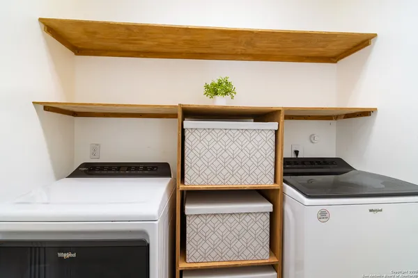 a utility room with washer and dryer