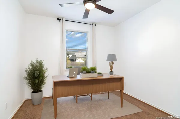 a view of a workspace with furniture