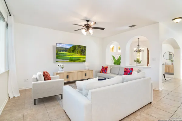 a living room with furniture and a flat screen tv